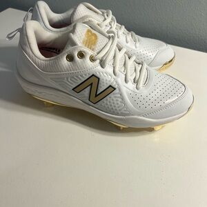 New Balance White and Gold Metal Cleats